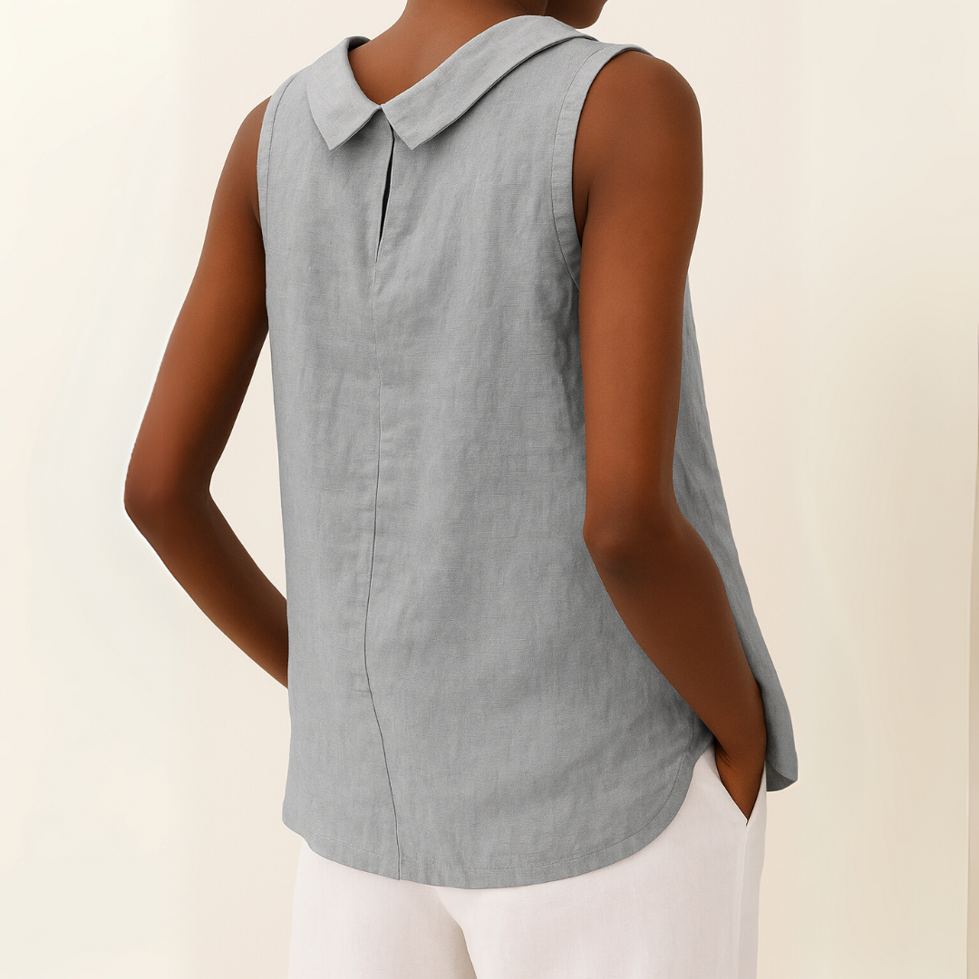 Women's white sleeveless roll collar top with a relaxed fit, made from a soft, flowing fabric.