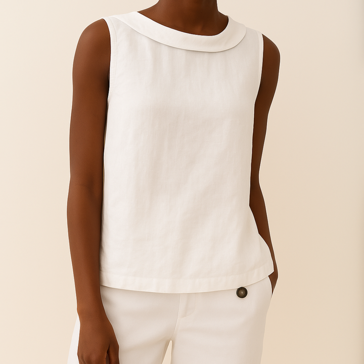 White women's sleeveless roll collar top with a relaxed fit, made from a soft, flowing fabric.