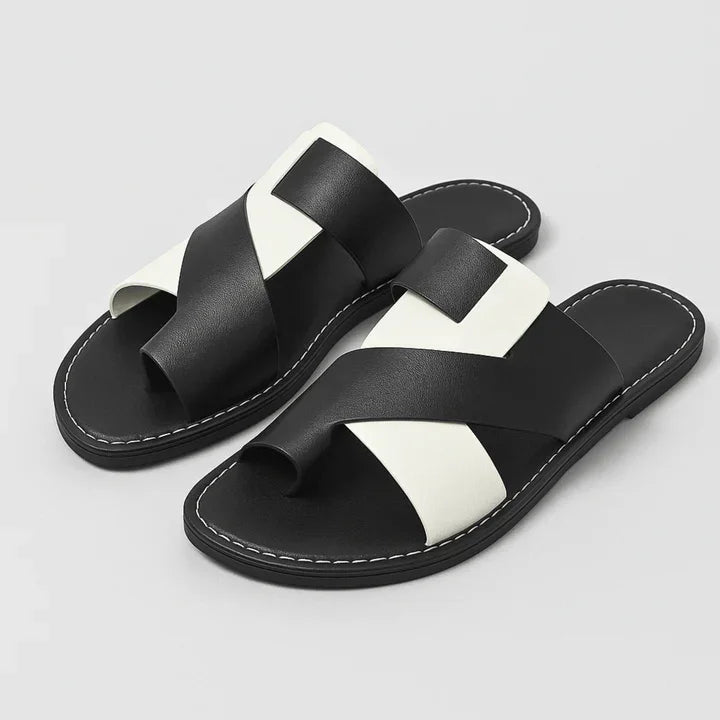 Women's Veda two-tone leather slide sandals with a toe loop, featuring brown and beige straps.
