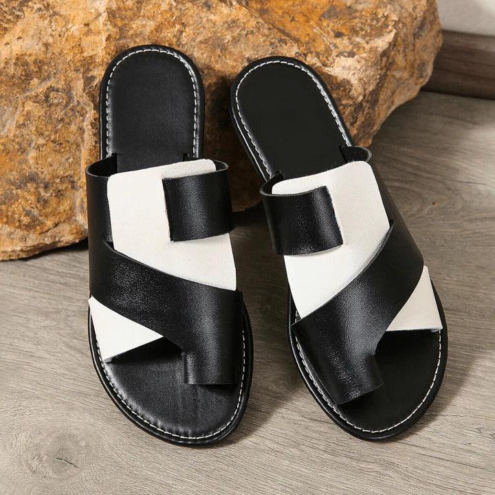 Women's Veda two-tone leather slide sandals with a toe loop, featuring brown and beige straps.