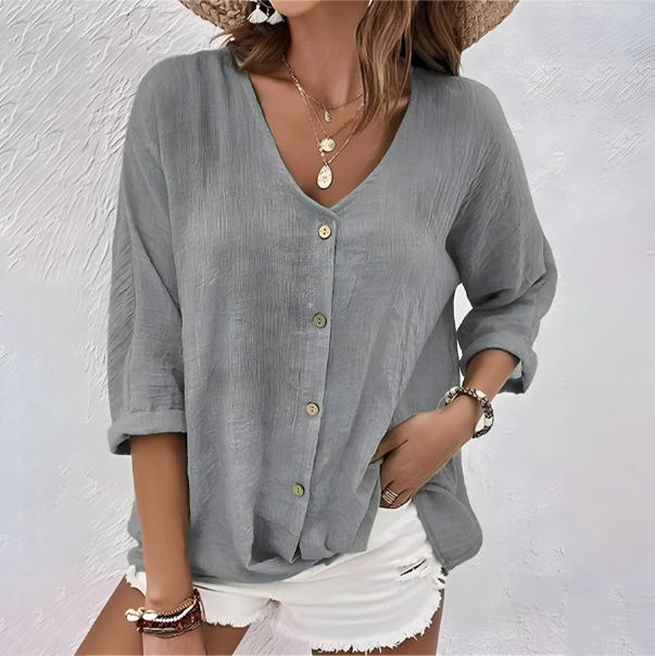 Gray women's V-neck button-up blouse in a soft, flowing fabric.