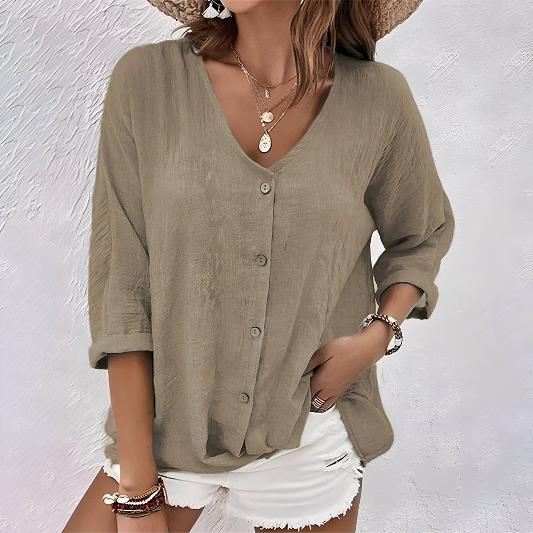 Khaki women's V-neck button-up blouse in a soft, flowing fabric.