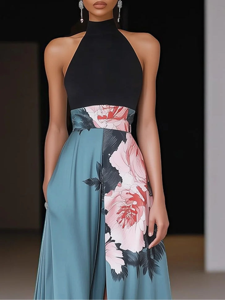 Women's sleeveless floral A-line maxi dress with side slit in a vibrant print.