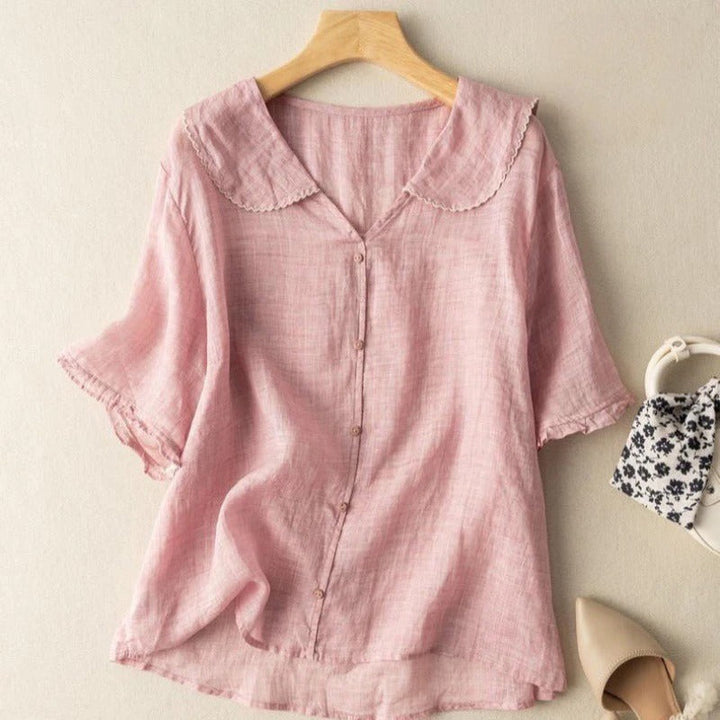 Pink Zinnia women's button-front blouse with a scalloped collar and short sleeves.
